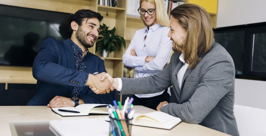 businessmen handshaking after deal agreement