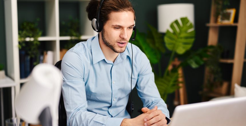 young man working as customer support in the office